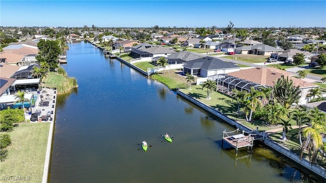 bird's eye view with a residential view and a water view