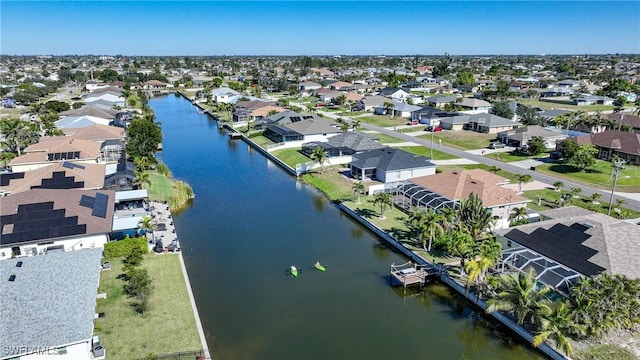 bird's eye view with a residential view and a water view