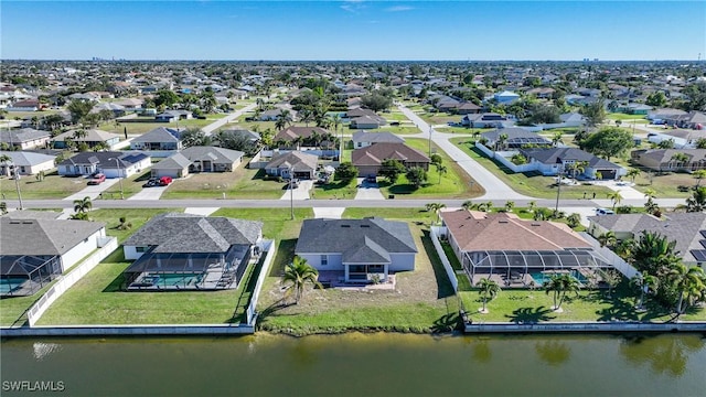 aerial view with a residential view and a water view