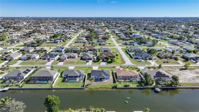 bird's eye view featuring a residential view and a water view