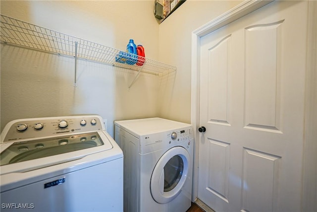 laundry area featuring laundry area and independent washer and dryer