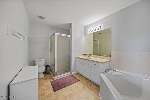 bathroom featuring visible vents, toilet, a stall shower, a bath, and vanity