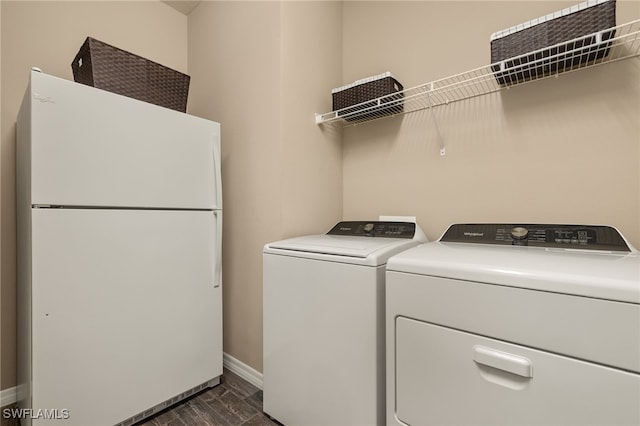 clothes washing area with washing machine and clothes dryer