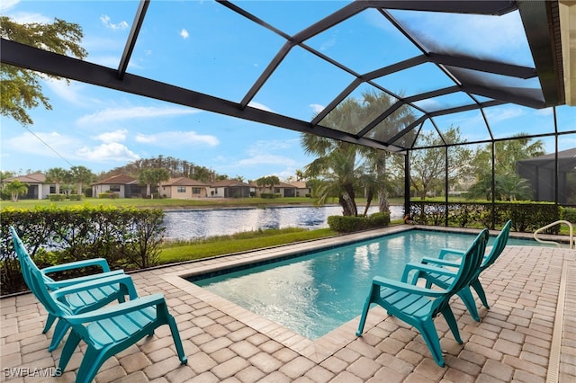 view of swimming pool with a lanai, a water view, and a patio