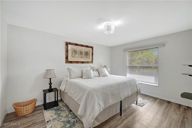 bedroom with light wood-type flooring