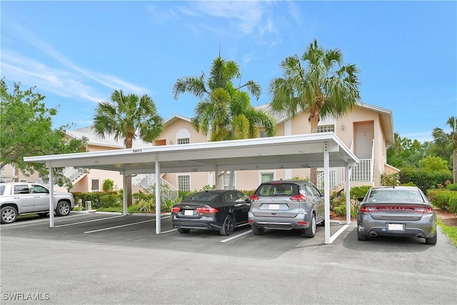 view of parking / parking lot featuring a carport