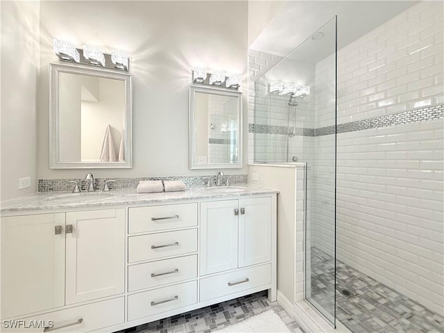 bathroom featuring vanity and an enclosed shower