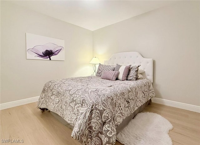 bedroom featuring hardwood / wood-style floors