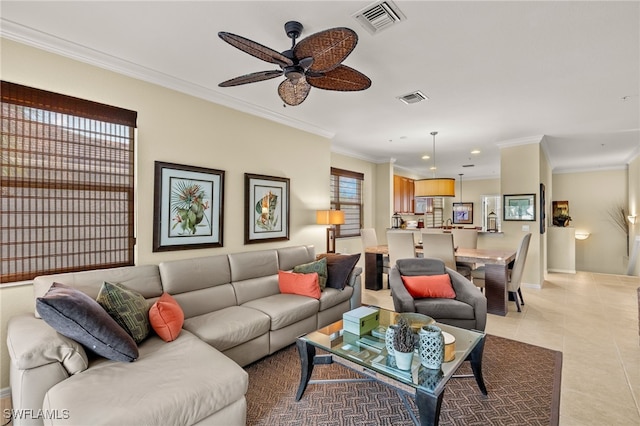 living room with ceiling fan, light tile patterned flooring, and crown molding