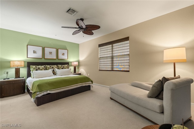 bedroom featuring ceiling fan and carpet