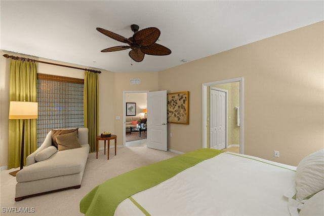 carpeted bedroom with ceiling fan and a closet