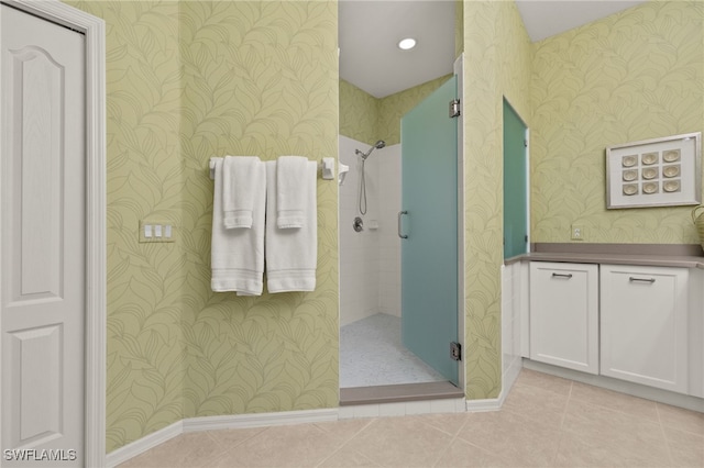 bathroom featuring tile patterned floors and an enclosed shower