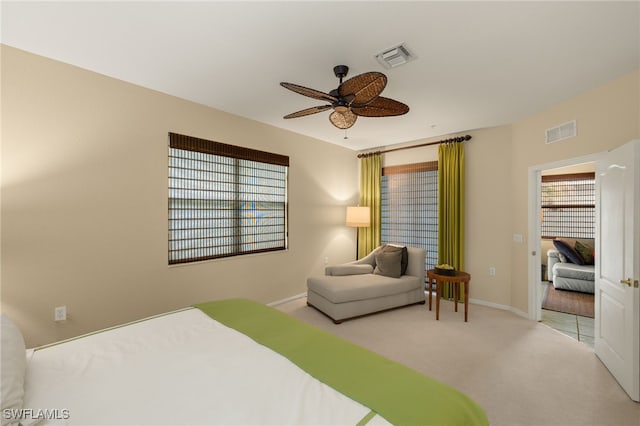 carpeted bedroom with ceiling fan