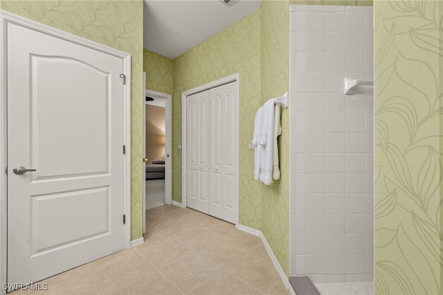 bathroom with tile patterned floors