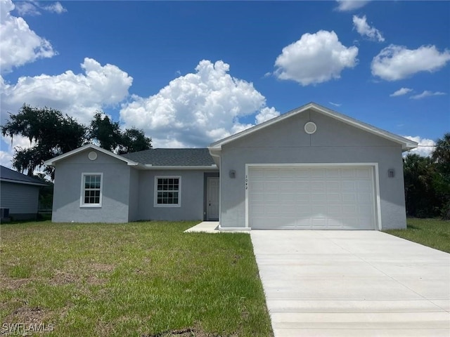 ranch-style home featuring a garage and a front lawn