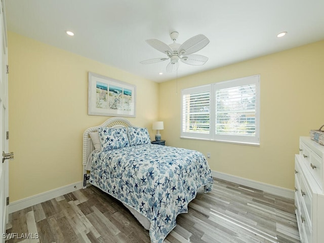 bedroom featuring light wood-type flooring and ceiling fan