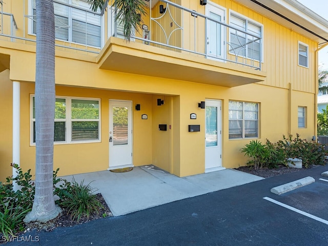 doorway to property featuring a balcony