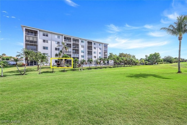 view of home's community featuring a yard