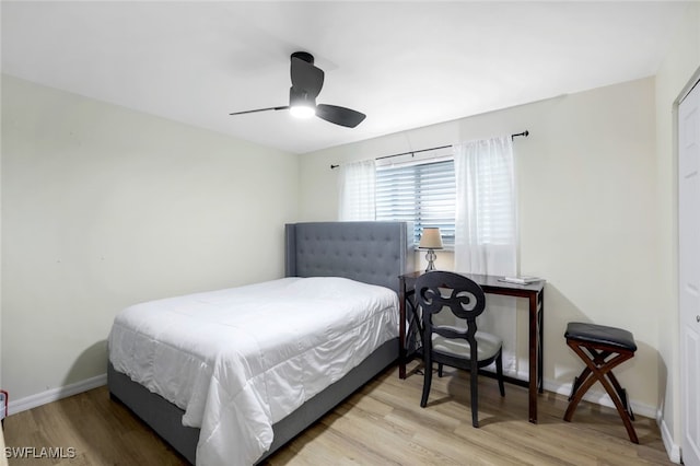 bedroom with ceiling fan and light hardwood / wood-style floors