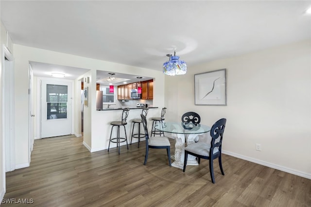 dining area featuring dark hardwood / wood-style floors