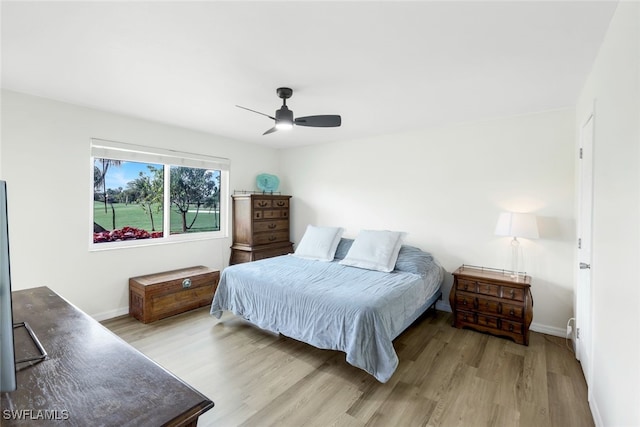 bedroom with ceiling fan and light wood-type flooring