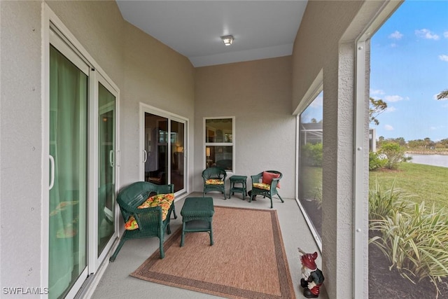 balcony featuring a water view