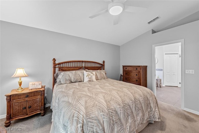 bedroom featuring ceiling fan, light colored carpet, and lofted ceiling