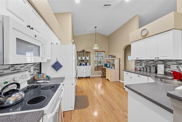 kitchen featuring white cabinets, decorative light fixtures, white appliances, and backsplash