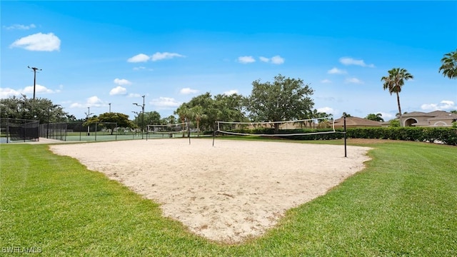 view of community with a yard and volleyball court