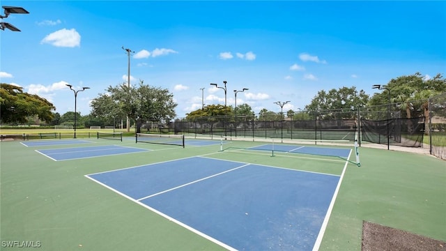 view of sport court with basketball hoop