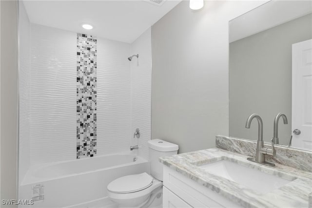 full bathroom with vanity, toilet, and tiled shower / bath combo