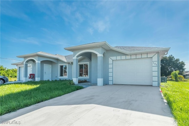 ranch-style house featuring a garage and a front yard