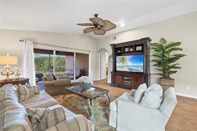 living room with ceiling fan, lofted ceiling, and light tile patterned flooring