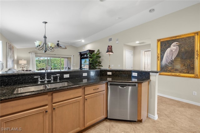 kitchen with dark stone countertops, sink, stainless steel dishwasher, and a notable chandelier