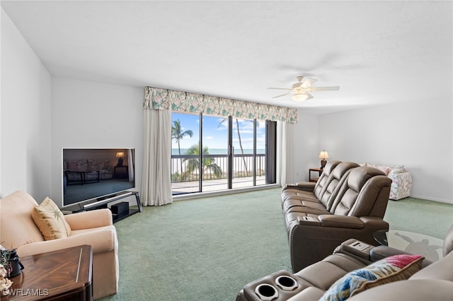 living room featuring carpet and ceiling fan