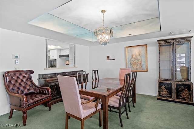 dining area featuring carpet floors and a chandelier