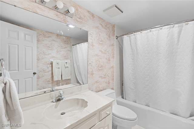 full bathroom with vanity, shower / bath combo, and toilet