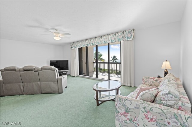 living room featuring carpet flooring and ceiling fan