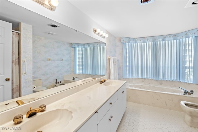 bathroom featuring vanity, toilet, and a bathtub