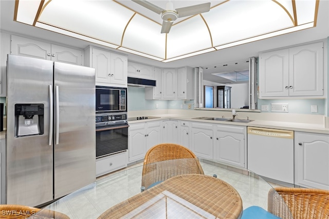 kitchen featuring ceiling fan, sink, white cabinets, and black appliances