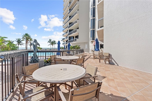 view of patio featuring a water view