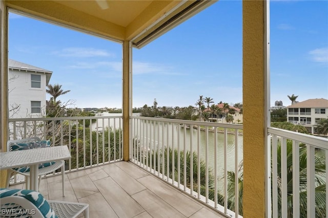 balcony featuring a water view