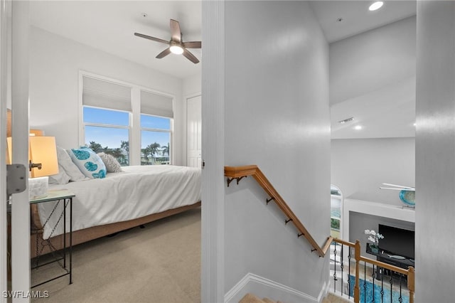 carpeted bedroom with ceiling fan