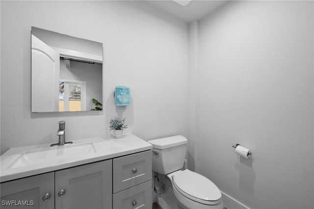 bathroom with toilet and vanity