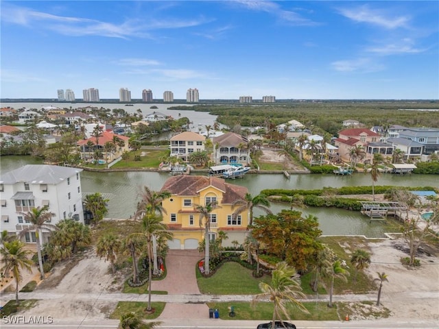 birds eye view of property with a water view