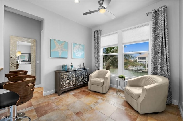 living area with ceiling fan