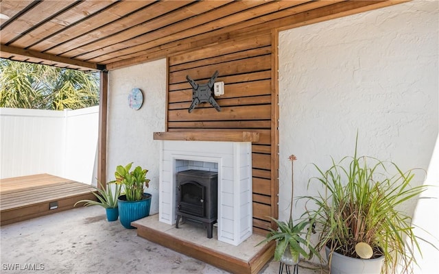 exterior space with a tile fireplace