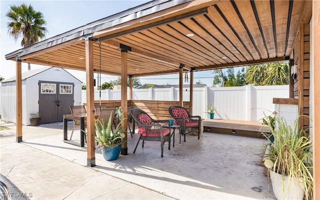 view of patio featuring a shed