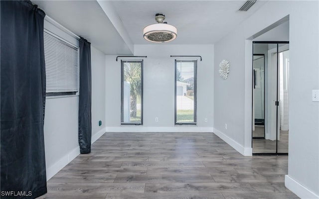 unfurnished room featuring light hardwood / wood-style flooring