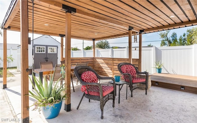 view of patio featuring a storage shed